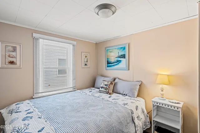 a view of a patio with couches chairs potted plants and floor to ceiling window