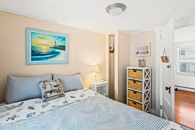 a view of a house with wooden deck and furniture