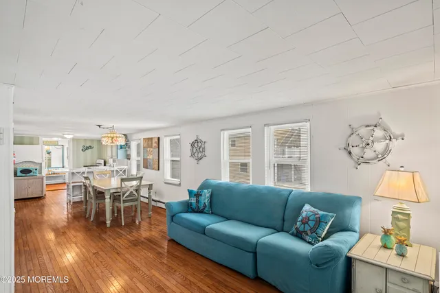 a bed room with a bed and a chandelier