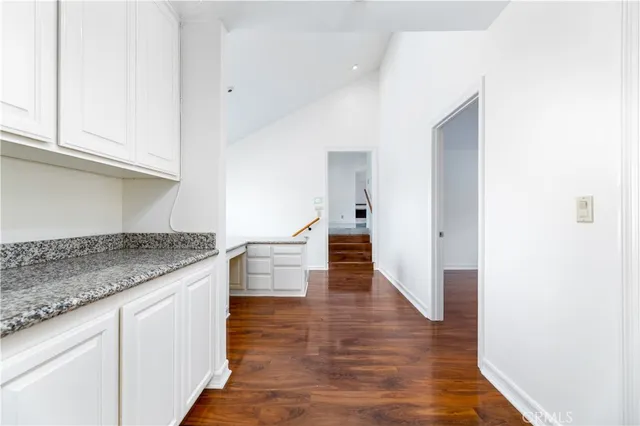 a kitchen with stainless steel appliances granite countertop a stove and a sink