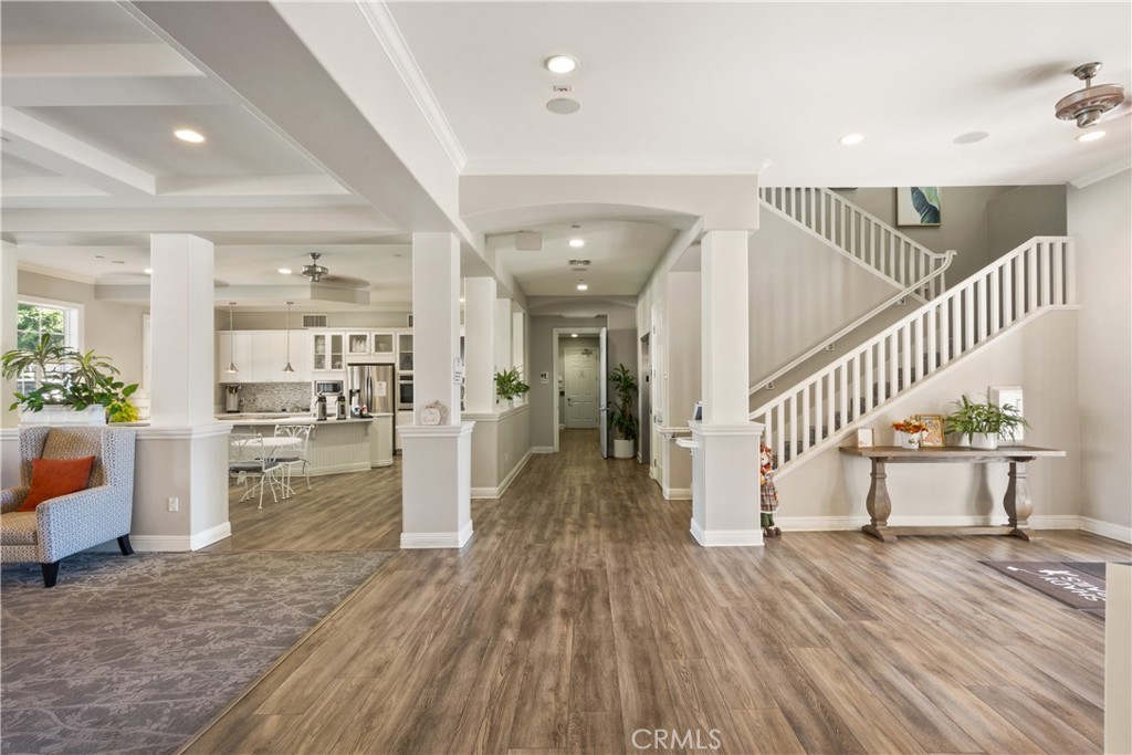 5604 Altamura Way, Unit 10 Fontana, CA 92336 - Photo 24 of 38 a view of entryway and hall with wooden floor