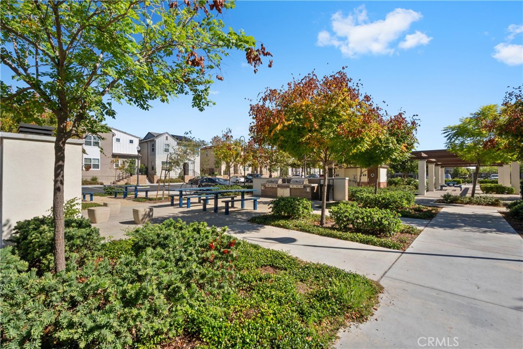 5604 Altamura Way, Unit 10 Fontana, CA 92336 - Photo 26 of 38 a house view with a garden space