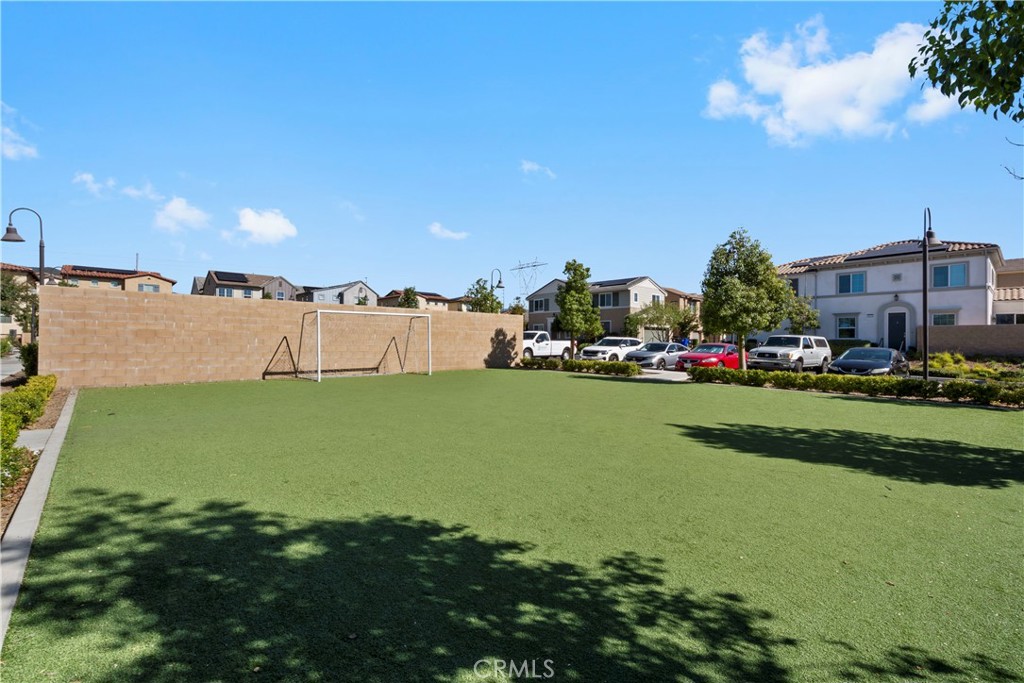 5604 Altamura Way, Unit 10 Fontana, CA 92336 - Photo 31 of 38 a view of yard with swimming pool and outdoor seating
