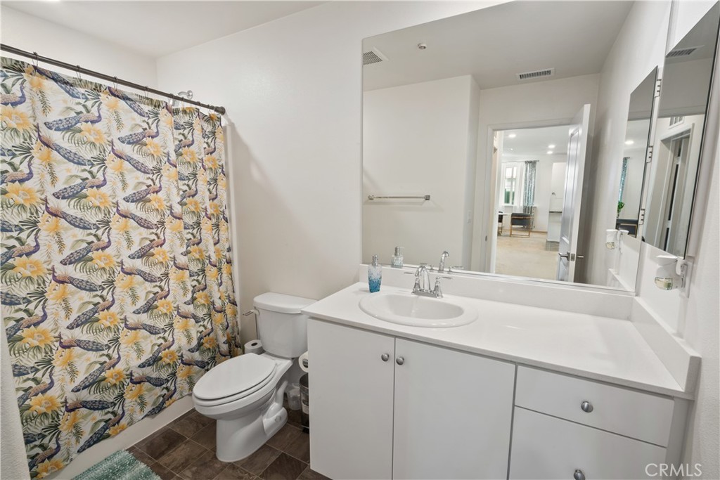 5604 Altamura Way, Unit 10 Fontana, CA 92336 - Photo 9 of 38 a bathroom with a sink and a mirror