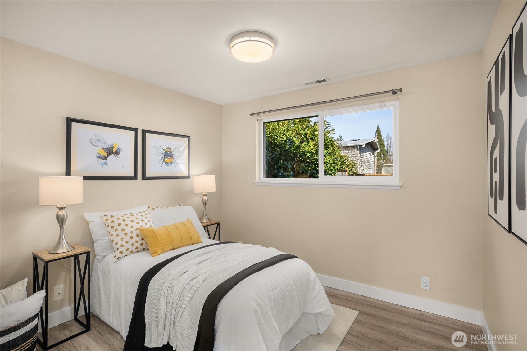 623 Aloha Way Edmonds, WA 98020 - Photo 16 of 28 a bed room with a bed and a painting on the wall