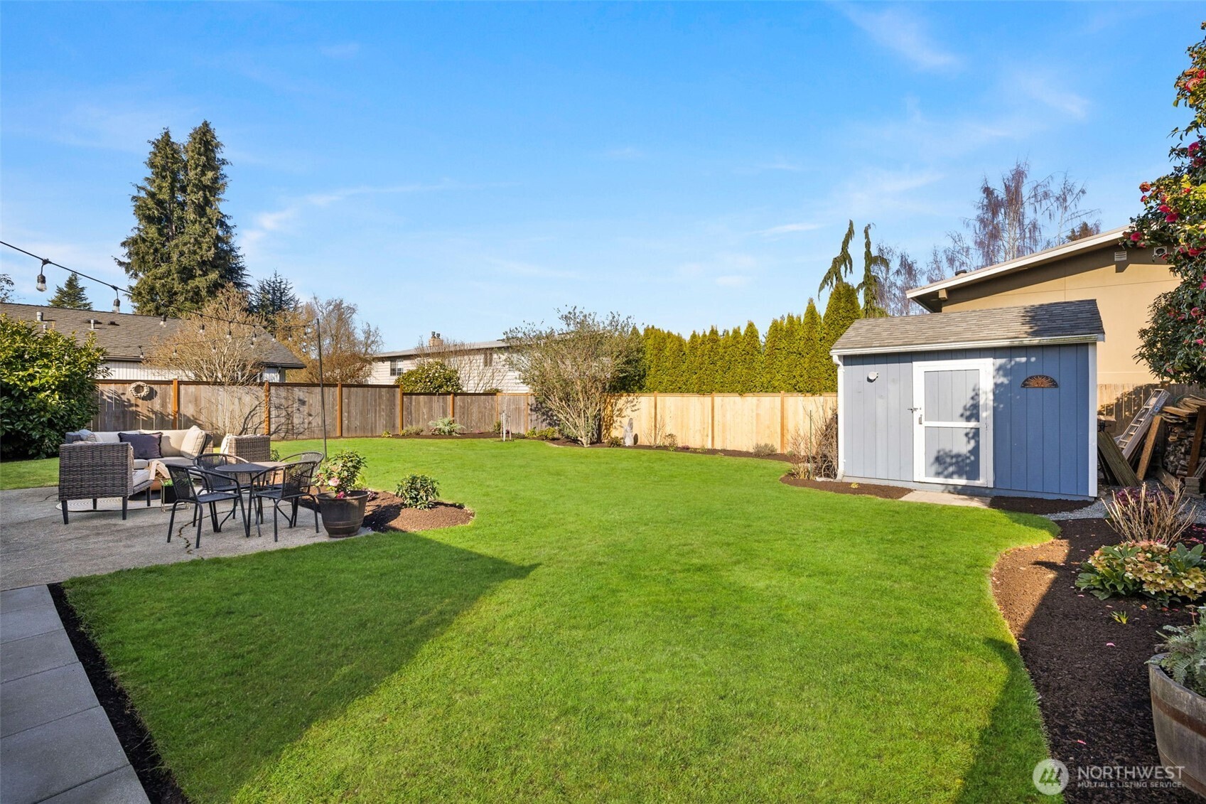 623 Aloha Way Edmonds, WA 98020 - Photo 19 of 28 a view of a house with a big yard and sitting area