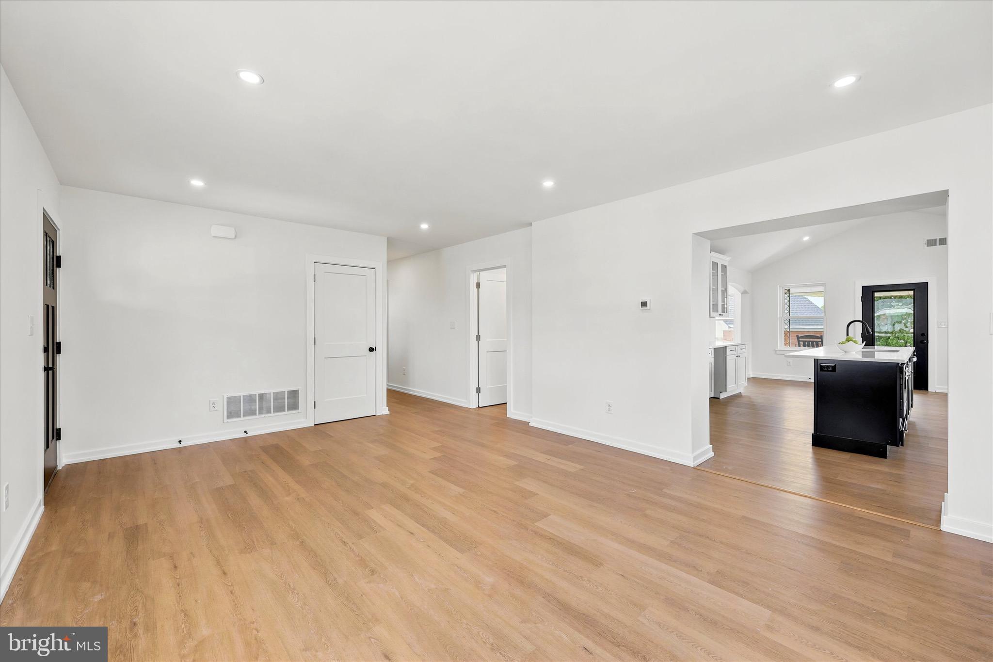 8 James Road Broomall, PA 19008 - Photo 7 of 35 a view of an empty room with wooden floor and a bathroom