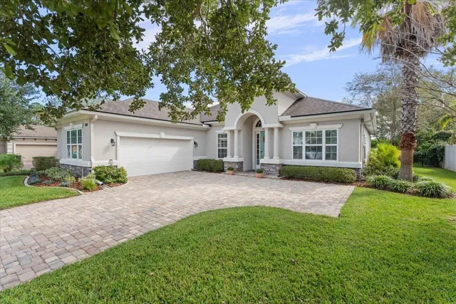front view of a house with a yard