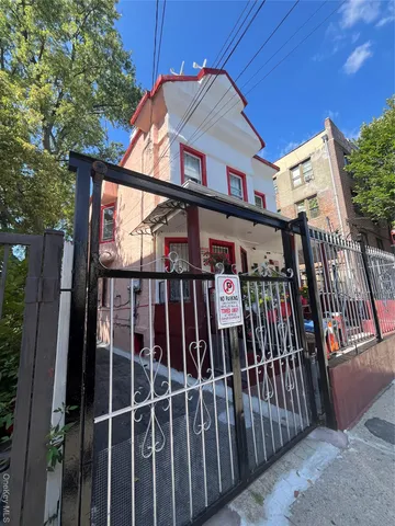 a view of a brick house with a large window