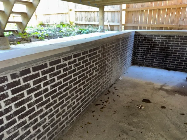 a view of a backyard with wooden fence