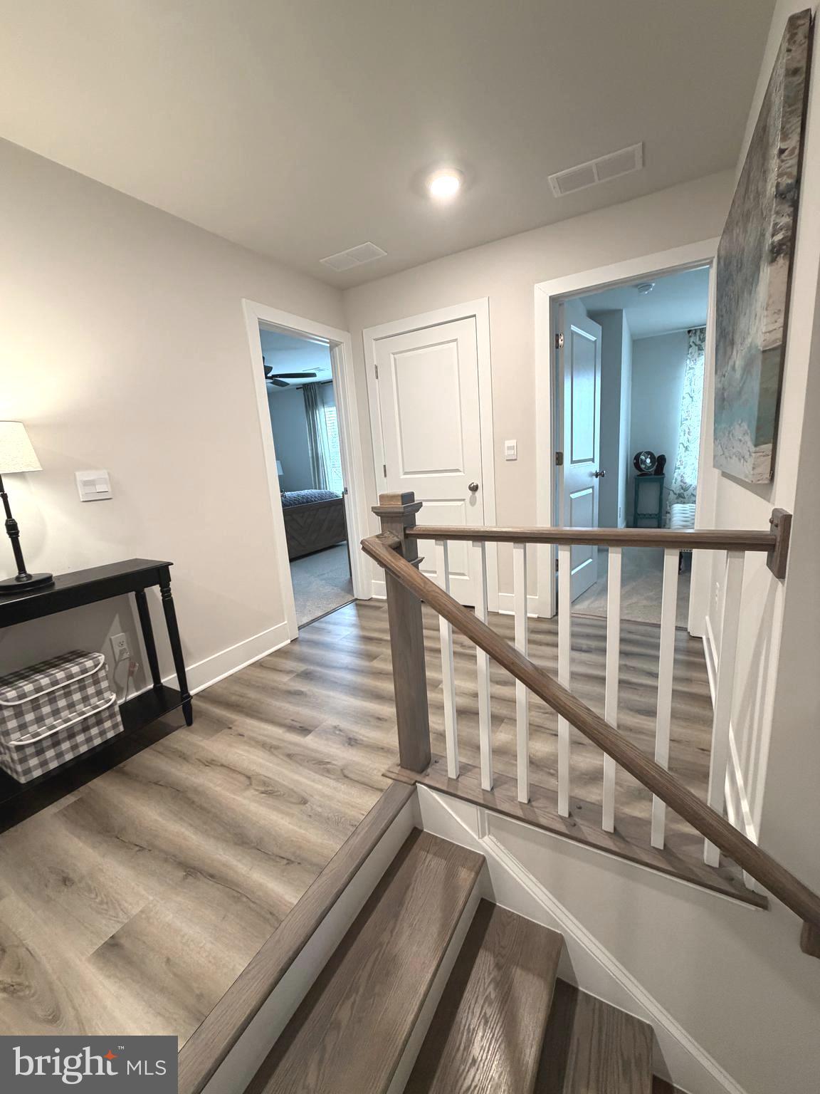 5030 Thornton Way Broad Run, VA 20137 - Photo 17 of 41 a view of a hallway with wooden floor and stairs