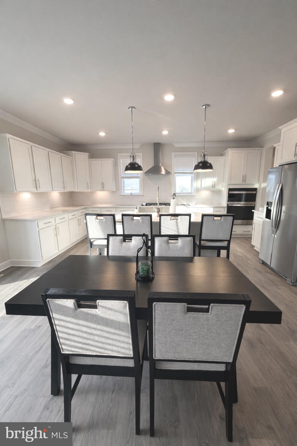 5030 Thornton Way Broad Run, VA 20137 - Photo 9 of 41 a kitchen with a table chairs sink and cabinets
