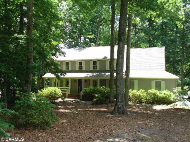1431 Kingscross Road Midlothian, VA 23114 - Photo 1 of 21 Exterior Front - Full front porch on masonry foundation with aggregate concrete floor. Sunshine makes roof appear white, but it's actually gray/brown and dimensional 30- year shingles(2012)