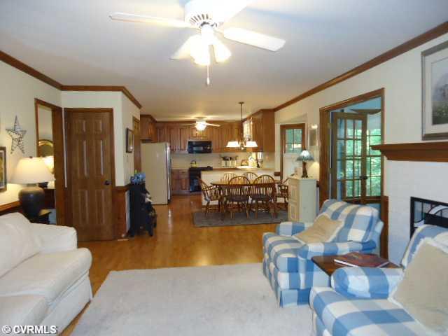 1431 Kingscross Road Midlothian, VA 23114 - Photo 6 of 21 Den/Family/Great Room - Wonderful open family room-kitchen includes coat closet and pantry, two sets of double French doors to Florida room. Wood-burning fireplace.