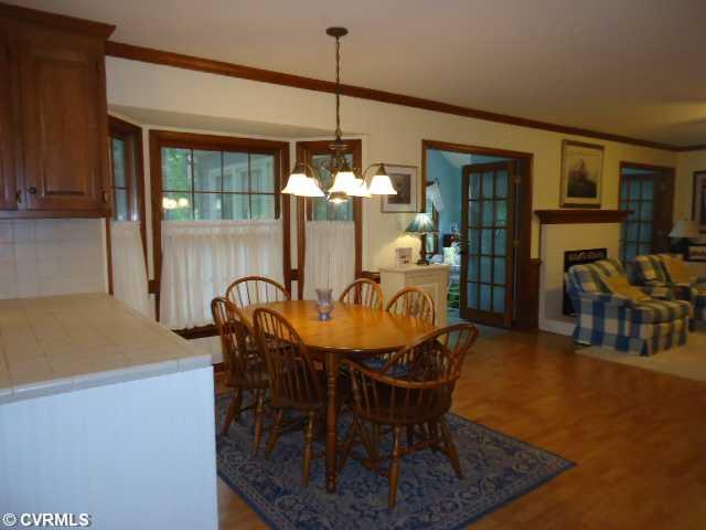 1431 Kingscross Road Midlothian, VA 23114 - Photo 7 of 21 Breakfast Nook - Kitchen features tile countertop and backsplash,raised panel cabinets and bay window.