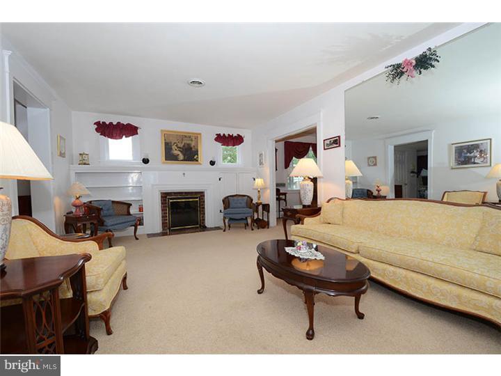 332 East Manoa Road Havertown, PA 19083 - Photo 2 of 14 a living room with furniture and a fireplace