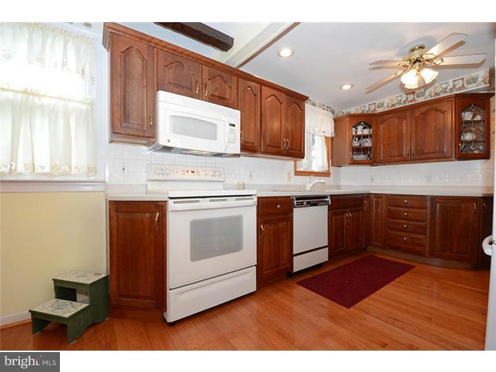 332 East Manoa Road Havertown, PA 19083 - Photo 4 of 14 a kitchen with stainless steel appliances granite countertop a stove a sink and a microwave