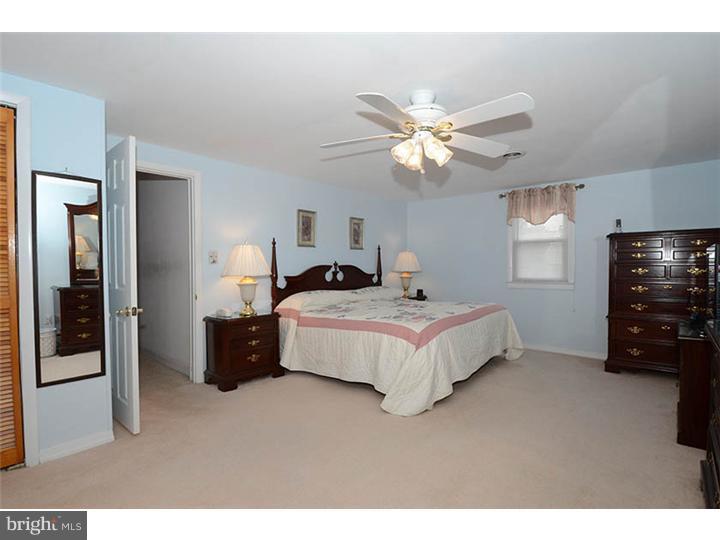 332 East Manoa Road Havertown, PA 19083 - Photo 8 of 14 a bedroom with a bed and a tv