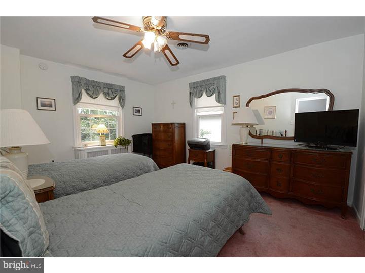 332 East Manoa Road Havertown, PA 19083 - Photo 9 of 14 a bedroom with a large bed and a window