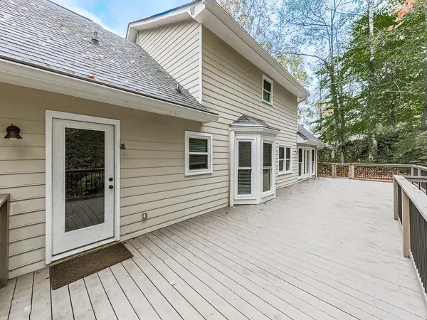 a view of a house with backyard sitting area