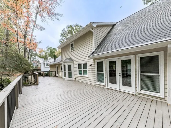 a view of a balcony with trees