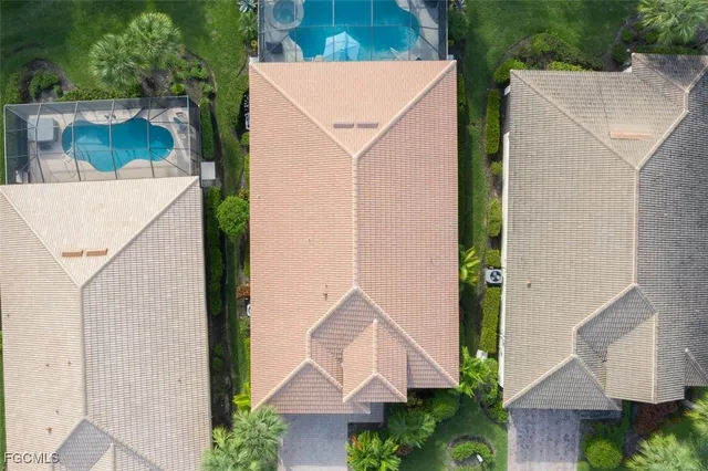 a living room with furniture a flat screen tv and a large window