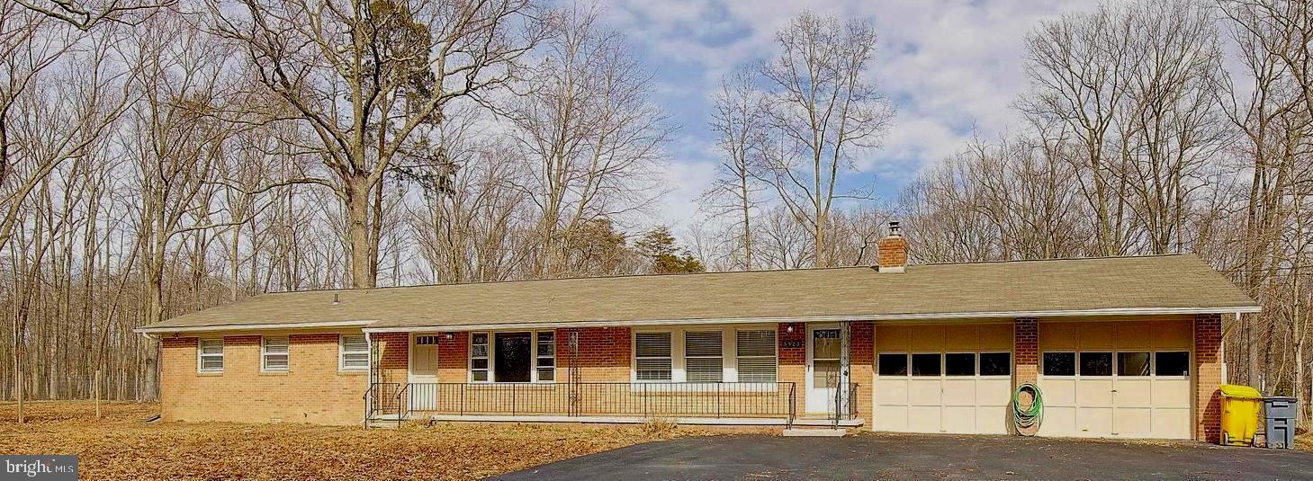 5823 Deale Beach Road Deale, MD 20751 - Photo 14 of 15 a front view of a house with large windows
