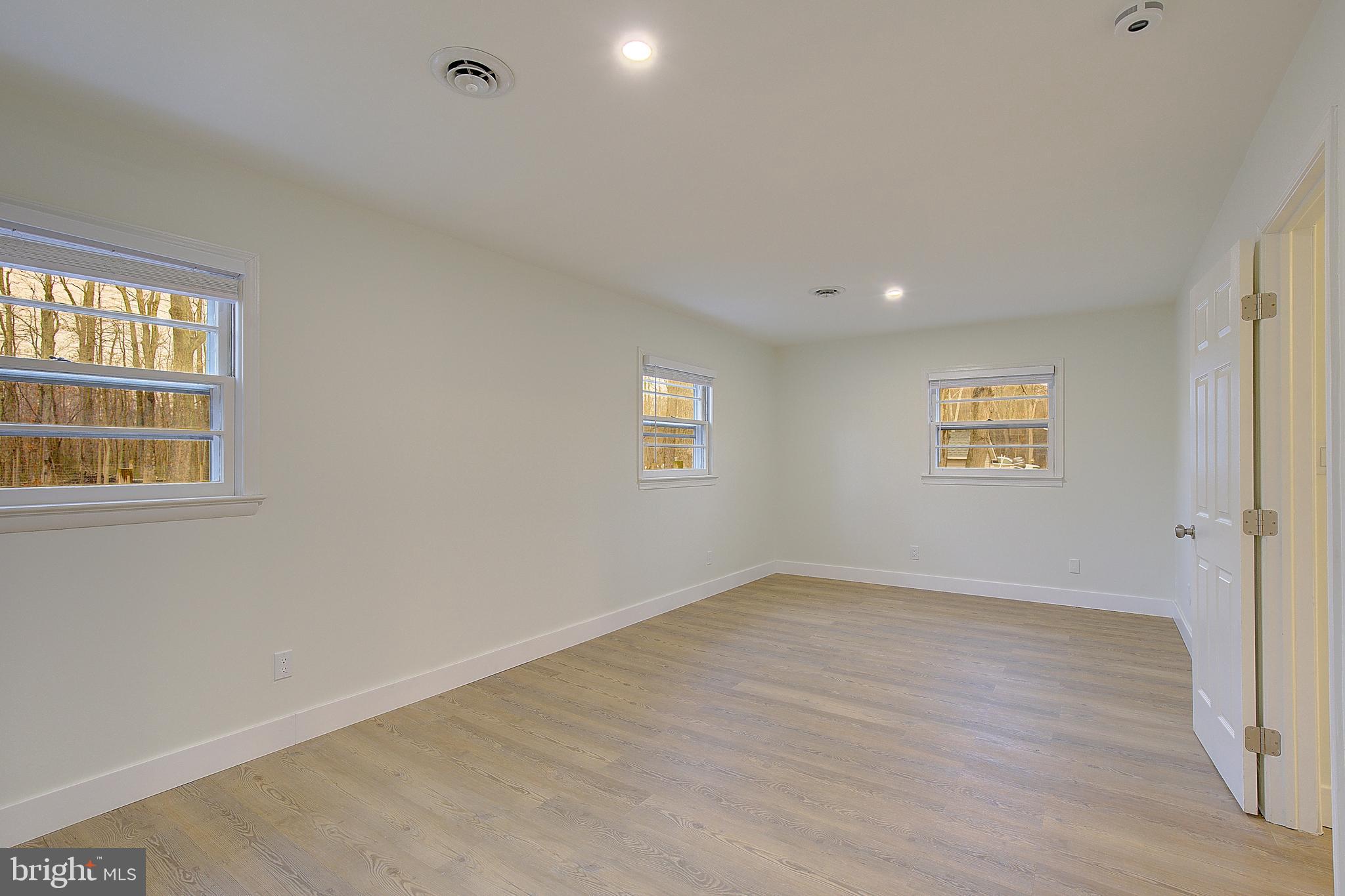 5823 Deale Beach Road Deale, MD 20751 - Photo 6 of 15 a view of an empty room with a window