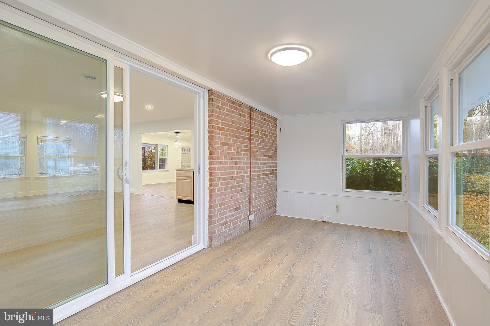 5823 Deale Beach Road Deale, MD 20751 - Photo 10 of 15 wooden floor in an empty room with a window