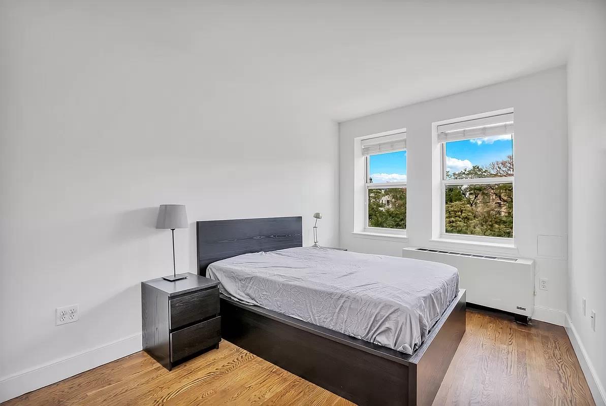 362 St Nicholas Avenue, Unit 9A Manhattan, NY 10027 - Photo 4 of 12 a bedroom with a bed and window