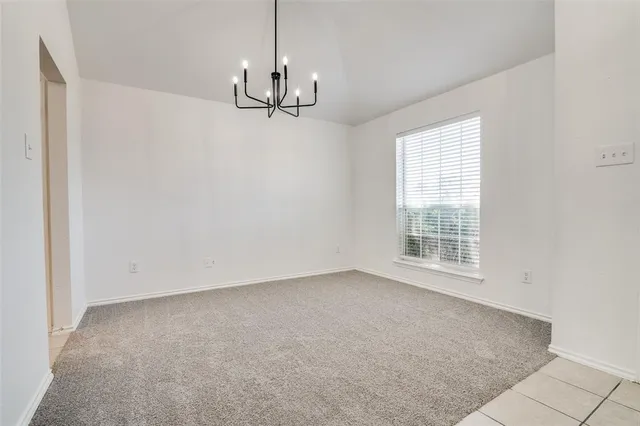 a view of empty room with windows