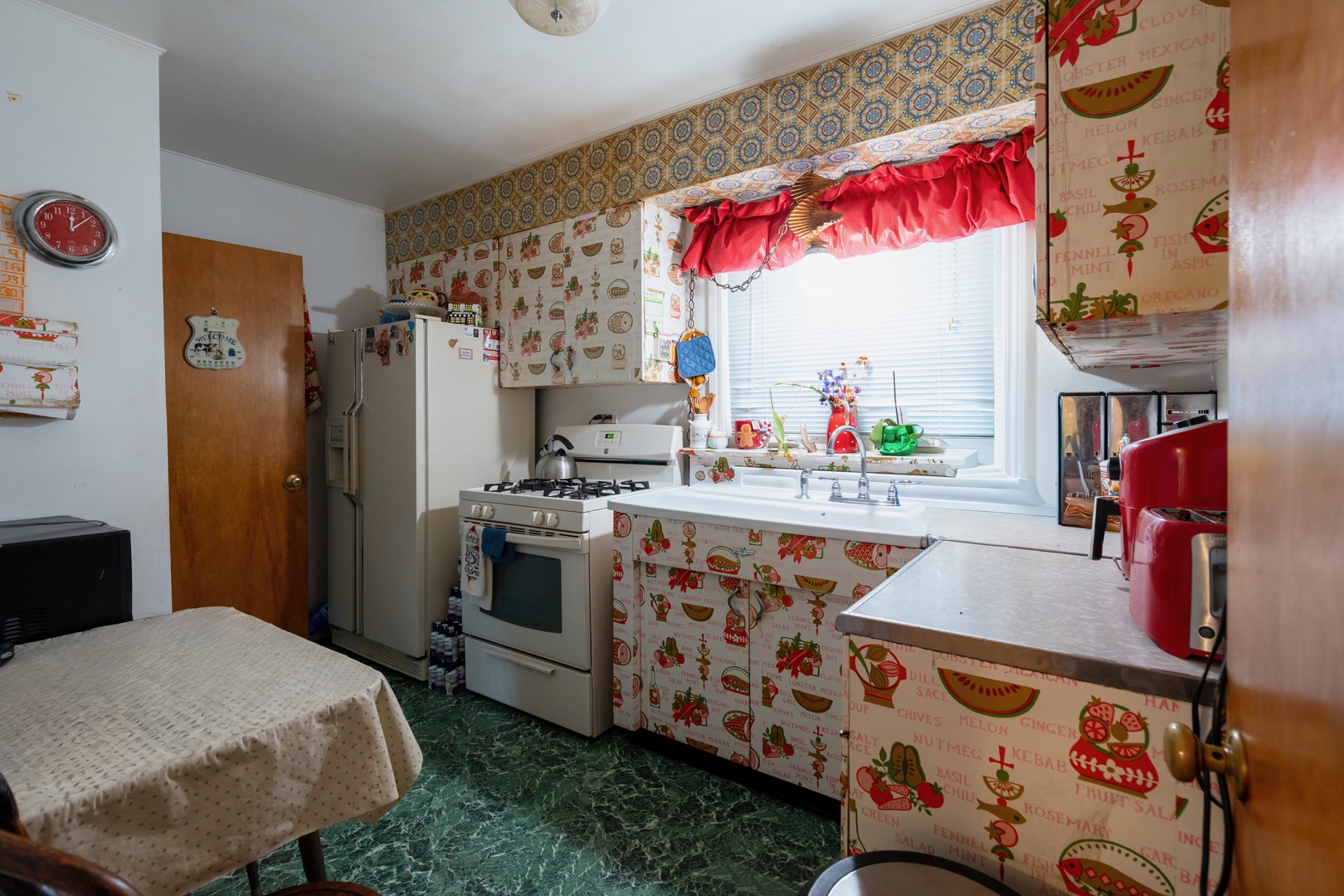 1744 Wesley Avenue Evanston, IL 60201 - Photo 11 of 31 a kitchen with stainless steel appliances granite countertop a stove and a refrigerator