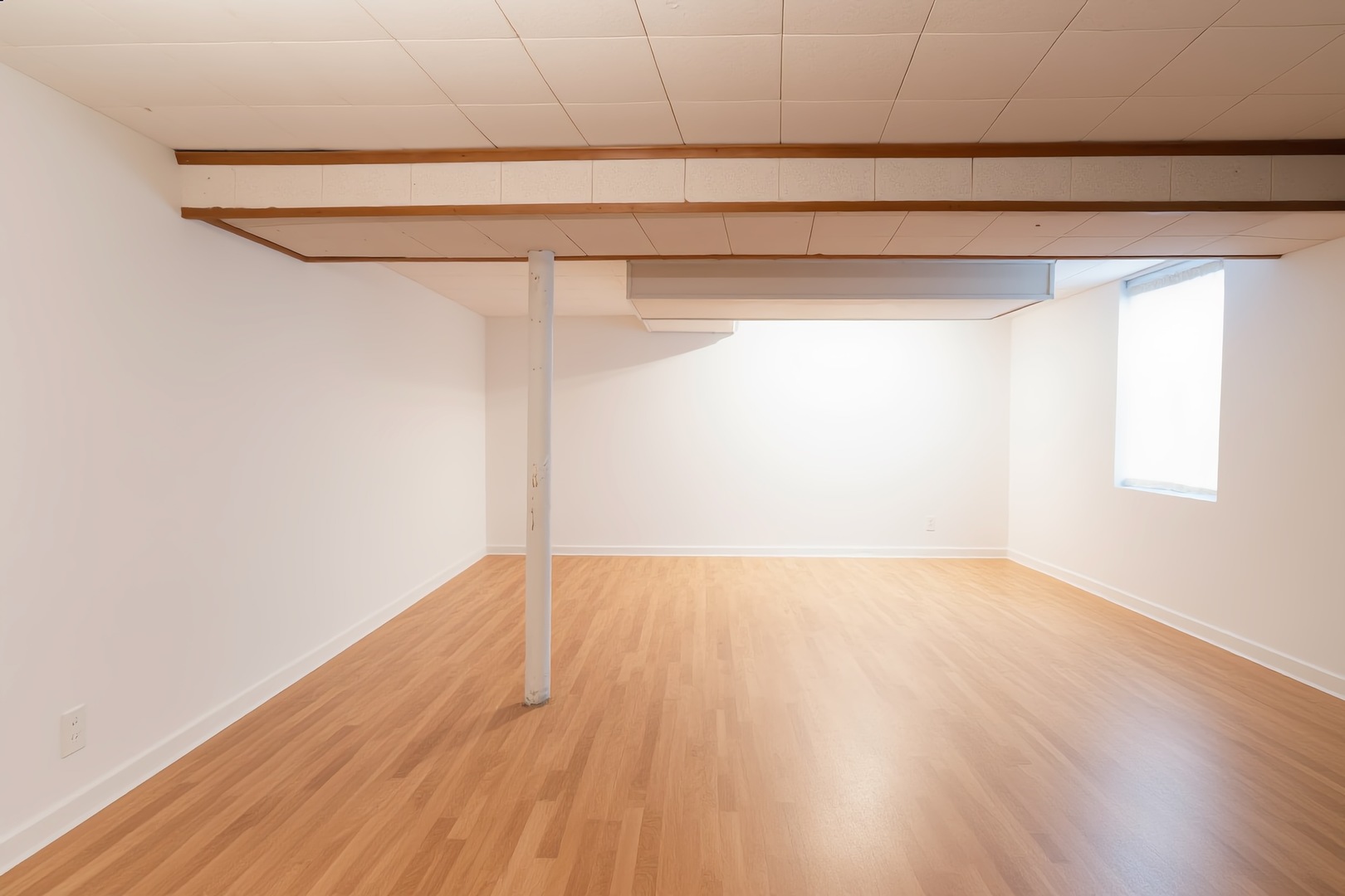 1744 Wesley Avenue Evanston, IL 60201 - Photo 25 of 31 a view of an empty room with wooden floor and a window