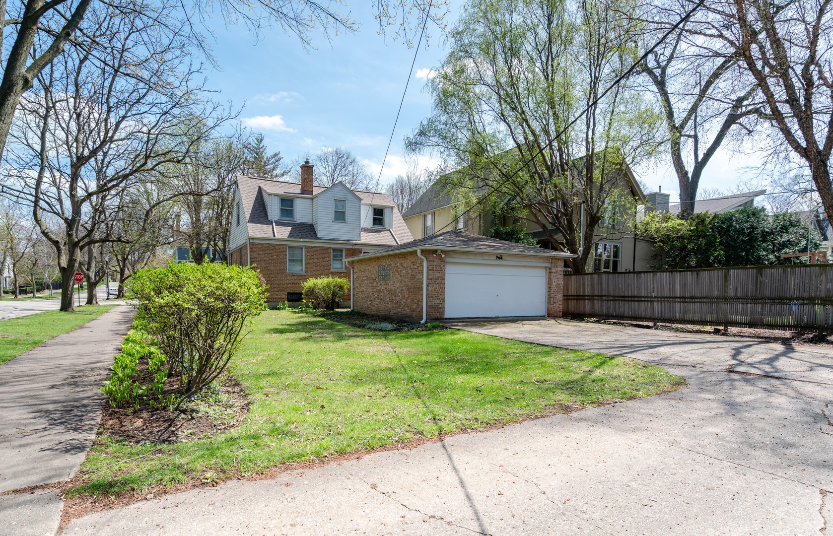 1744 Wesley Avenue Evanston, IL 60201 - Photo 31 of 31 a yellow house with trees in front of it