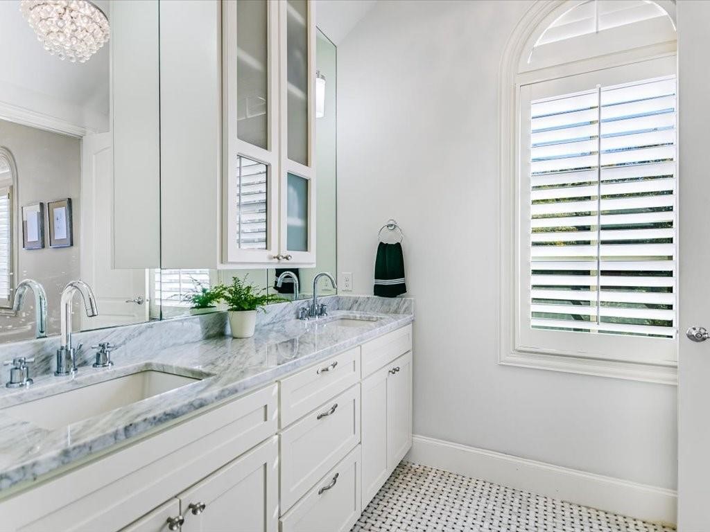 800 Rosedale Terrace, Unit B Austin, TX 78704 - Photo 20 of 40 Primary bathroom with dual sinks and great natural light.