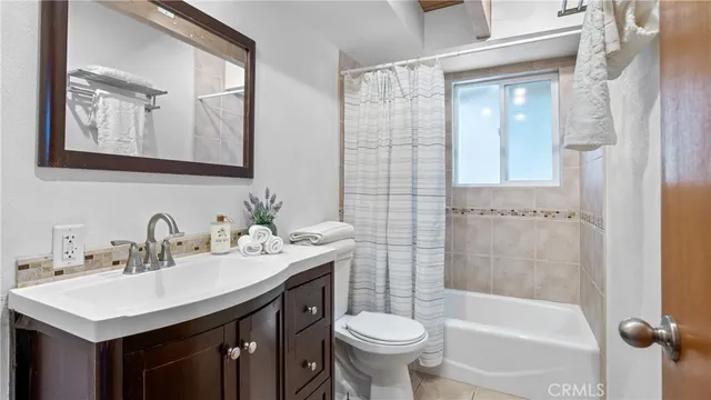 a view of walk in closet with wooden floor