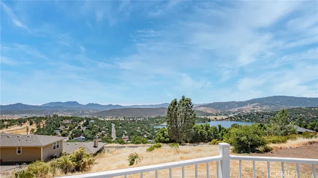 a view of a hallway with wooden floor and glass door