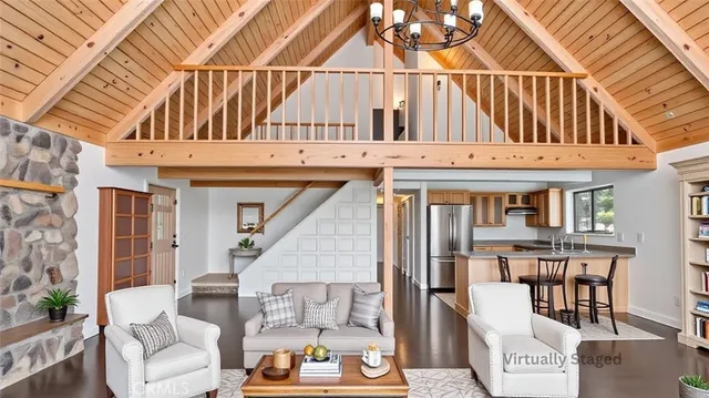 a view of a large white building next to a yard