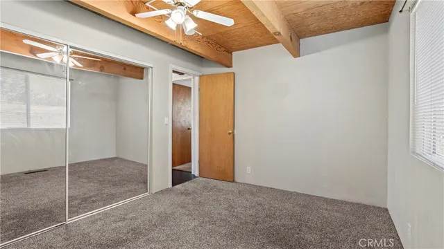 a view of house with outdoor space and sitting area