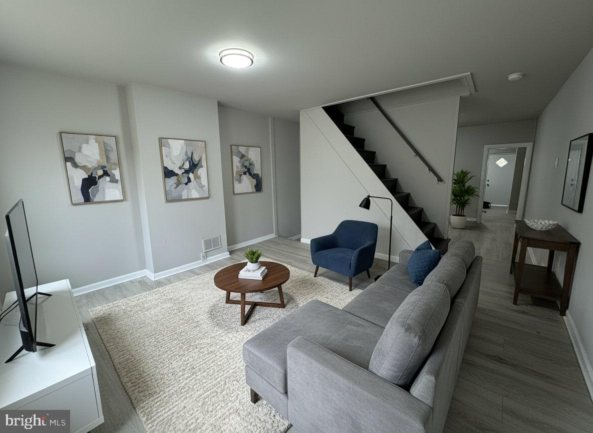 70 East Walnut Lane Philadelphia, PA 19144 - Photo 2 of 11 a living room with furniture and stairs