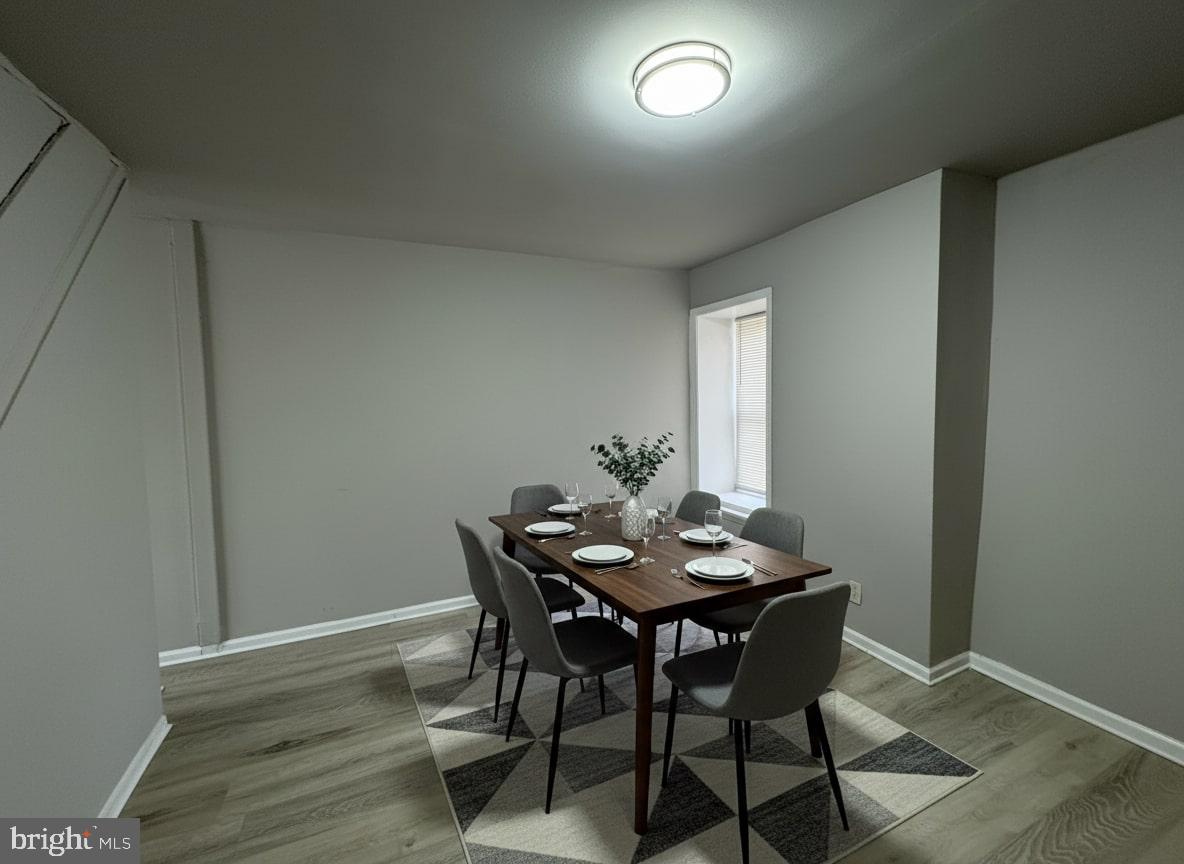 70 East Walnut Lane Philadelphia, PA 19144 - Photo 3 of 11 a view of a dining room with furniture and wooden floor