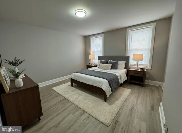 a bedroom with a bed and a couch