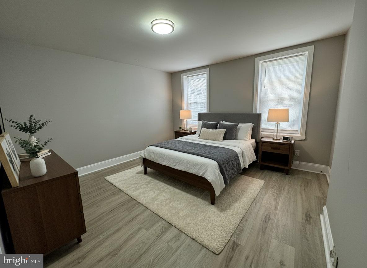 70 East Walnut Lane Philadelphia, PA 19144 - Photo 5 of 11 a bedroom with a bed and a couch