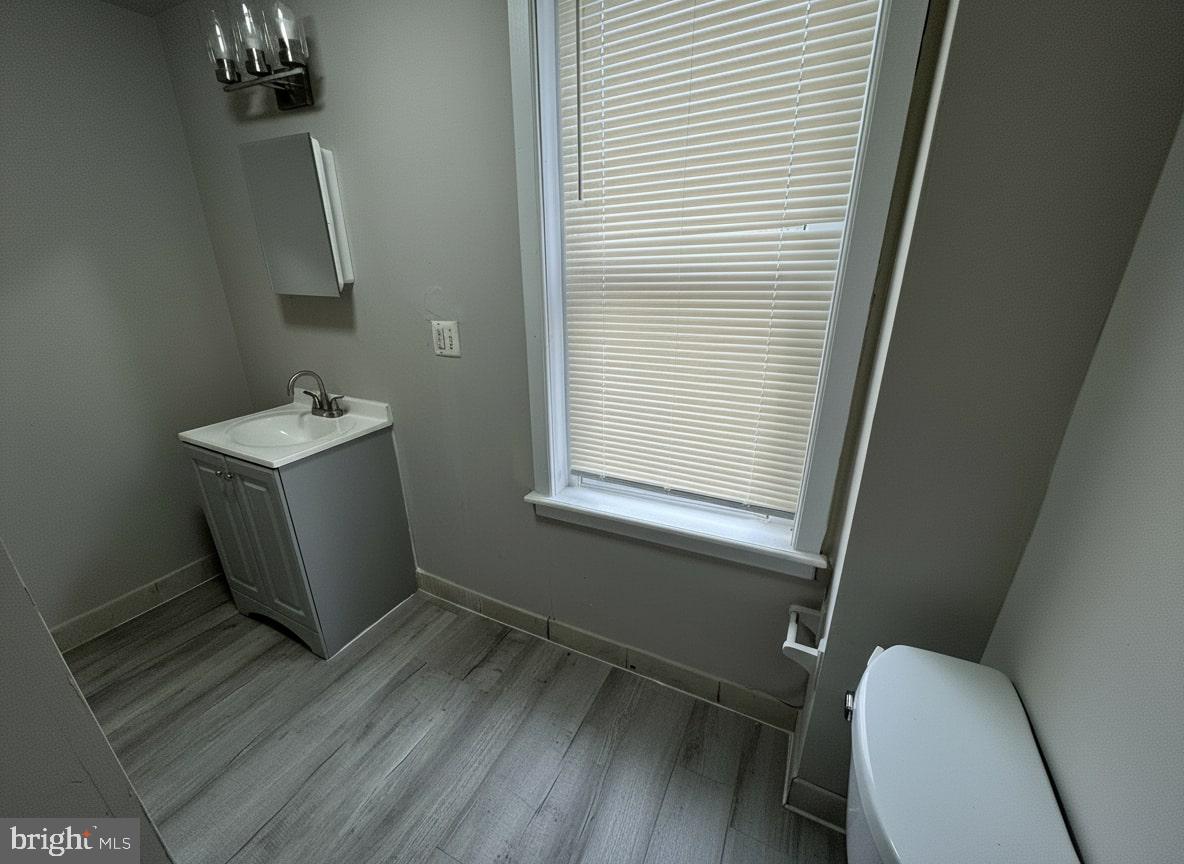 70 East Walnut Lane Philadelphia, PA 19144 - Photo 9 of 11 a bathroom with a sink a toilet and a mirror