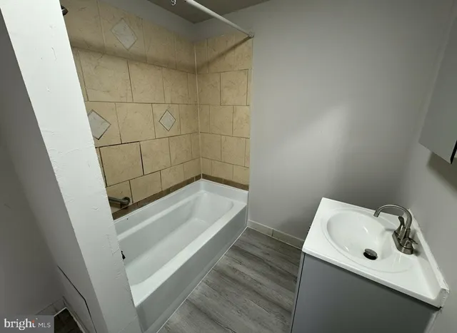 a bathroom with a sink and shower