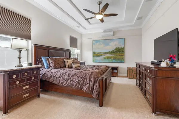 a bathroom with a granite countertop sink a toilet and a mirror