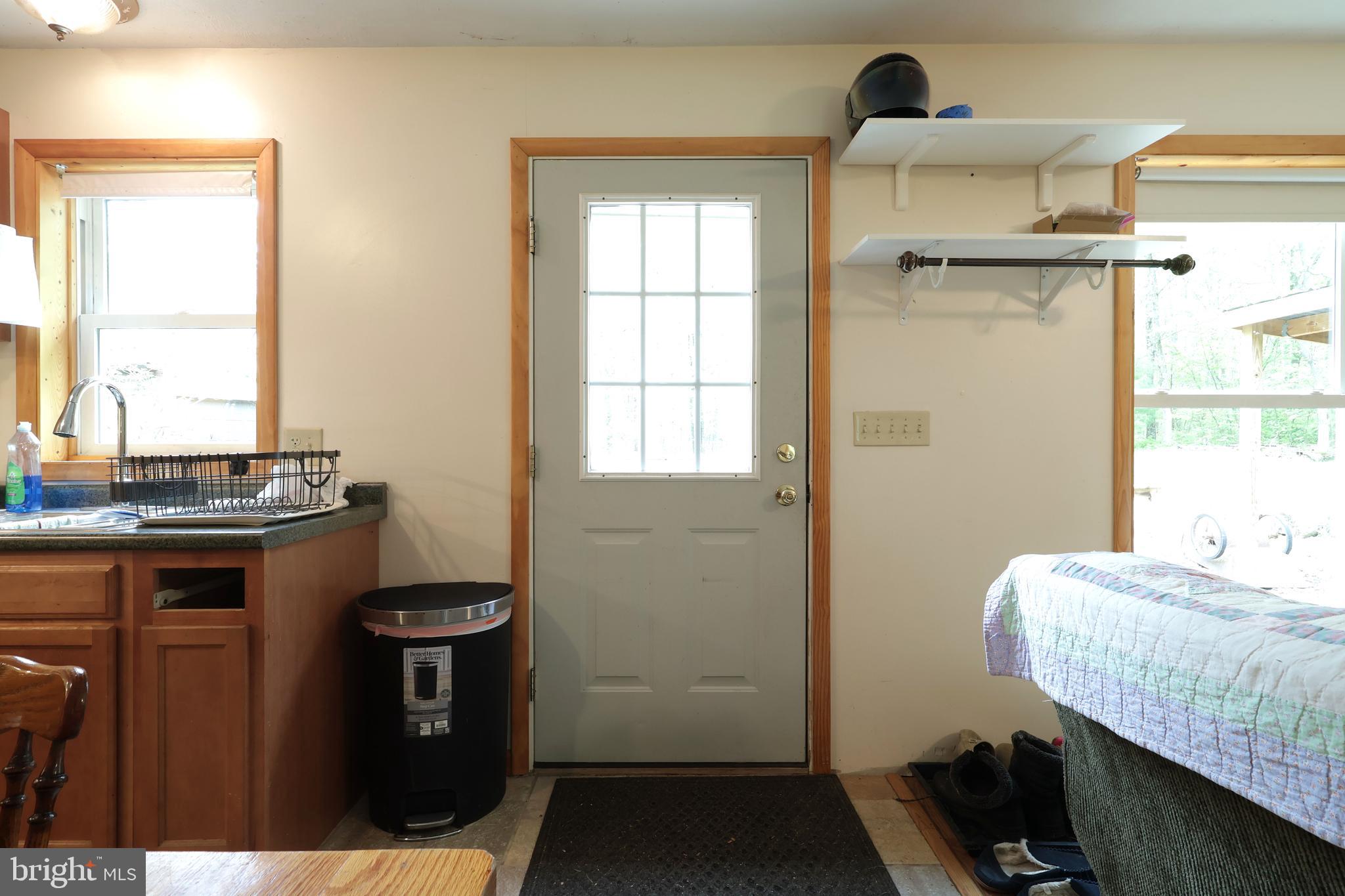 358 Buckridge Road Howard, PA 16841 - Photo 5 of 40 a bedroom with a bed and a window