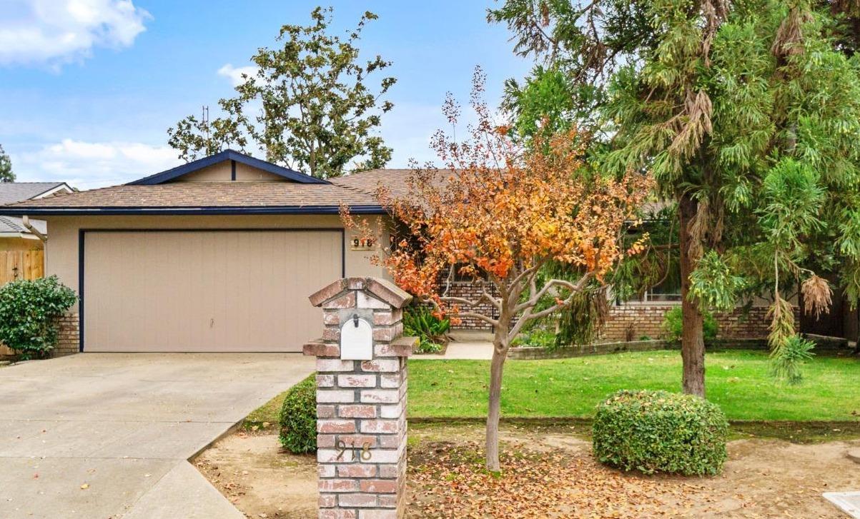 918 East Griffith Way Fresno, CA 93704 - Photo 11 of 21 a front view of a house with garden