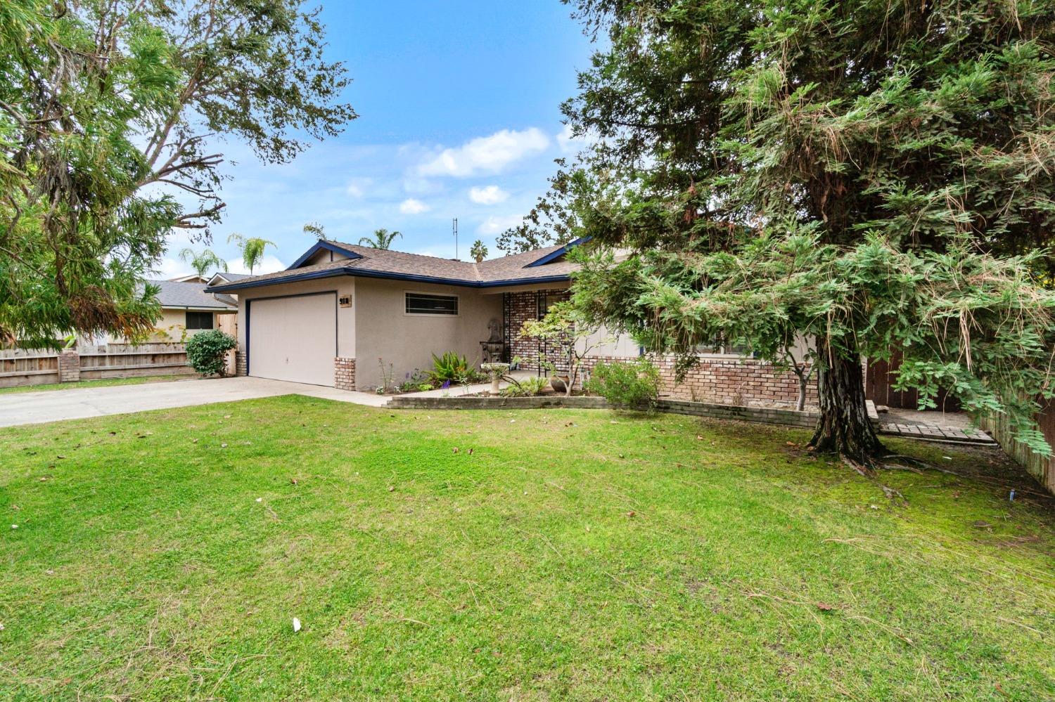 918 East Griffith Way Fresno, CA 93704 - Photo 19 of 21 a view of a house with a yard