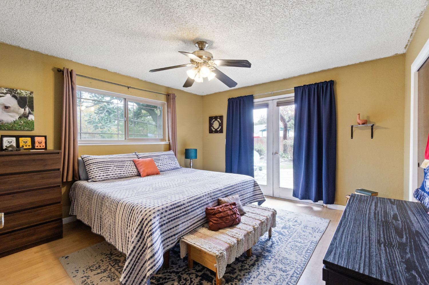 918 East Griffith Way Fresno, CA 93704 - Photo 5 of 21 a bedroom with a bed and a window